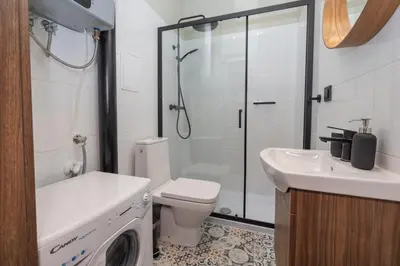 a bathroom with a toilet and a sink and a shower at 3 bedroom - Grodzka Street - Old Town in Kraków