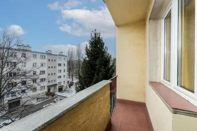 a balcony with a view of a city at Nowa Huta Charming Details Apartment by BookingHost in Kraków
