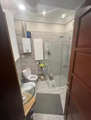 a bathroom with a shower and a toilet and a sink at 5 min from city center by feet in Kraków
