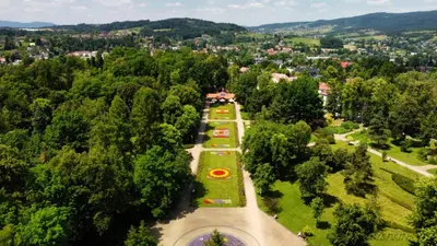 an overhead view of a park with trees and a city at Apartament in Rabka