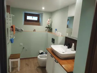 a bathroom with a sink and a toilet at Apartament in Rabka