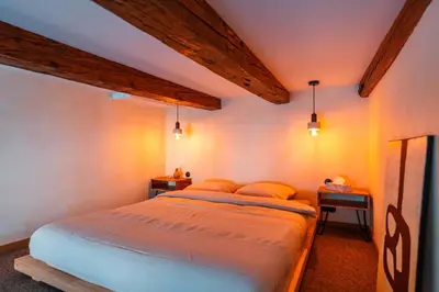 a bedroom with a large bed in a room at Cozy studio in the center of Krakow in Kraków