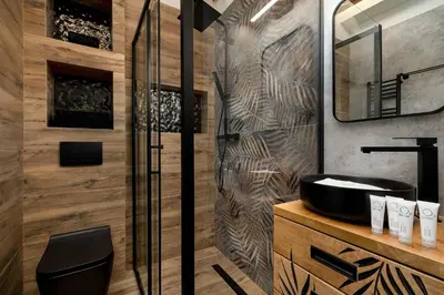 a bathroom with a black sink and a shower at Komfortowy Apartament z Klimatyzacją by Noclegi Renters in Kraków