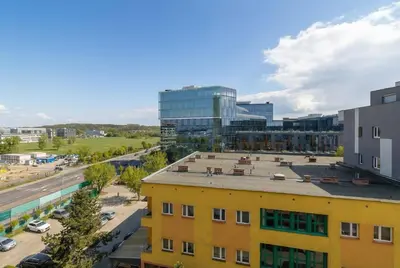 an aerial view of a city with a yellow building at Komfortowy Apartament z Klimatyzacją by Noclegi Renters in Kraków