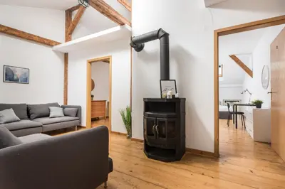 a living room with a fireplace and a couch at Old Town Loft - 7 Bedroom Apartment - by Upstairs in Kraków