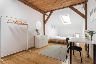 a white room with a desk and a bed at Old Town Loft - 7 Bedroom Apartment - by Upstairs in Kraków