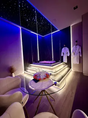 a room with a purple pool in a room at Starowiślna Prestige VIP Apartamenty Jacuzzi in Kraków
