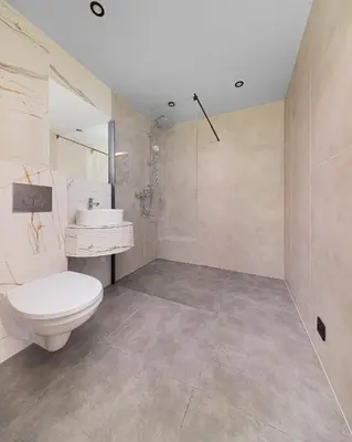 a bathroom with a toilet and a sink and a shower at Moon Glamping