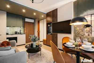 a kitchen with a sink and a counter top at Smolensk Loft Suite - homfi Collection in Kraków