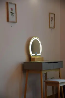 a dressing table with a mirror on top of it at Apartment Tomasza 8 in Kraków