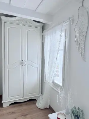 a room with a white cabinet and a window at Domek na szlaku 70 in Skomielna Biała