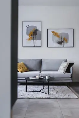 a living room with a couch and a table at Apartamenty EN Zator in Podolsze