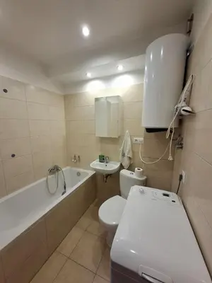 a bathroom with a white toilet and a sink at Mieszkanie na Jurze Południowej pod Krakowem in Krzeszowice