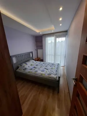 a bedroom with a bed in a room with a window at Mieszkanie na Jurze Południowej pod Krakowem in Krzeszowice