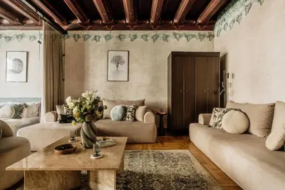 a window in a room with a painting on the wall at Fresco Residence by Tyzenhauz in Kraków