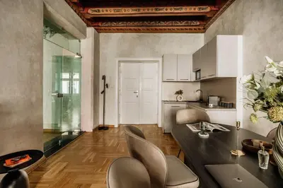 a living room with a couch and a coffee table at Fresco Residence by Tyzenhauz in Kraków