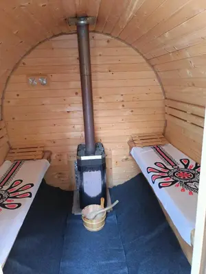 a room with two beds in a sauna at Zawoja domek do wynajęcia in Zawoja