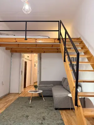 a living room with a loft bed and a couch at Meiselsa Residence in Kraków