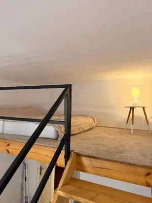 a room with two bunk beds and a lamp at Meiselsa Residence in Kraków