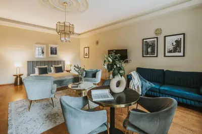 a living room with a couch and a bed at Bogoria House in Kraków