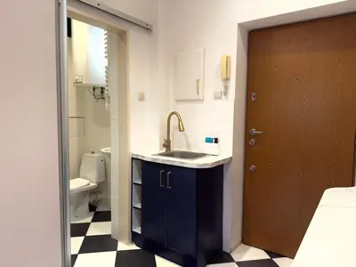 a bathroom with a sink and a toilet at Premium Studio - Free Parking - Near Old Town in Kraków