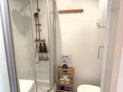 a bathroom with a shower with a toilet and a sink at Premium Studio - Free Parking - Near Old Town in Kraków