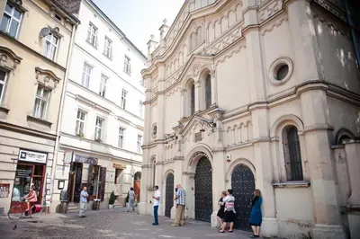 a group of people standing outside of a building at Loft Apartment Industrial Design in Kraków