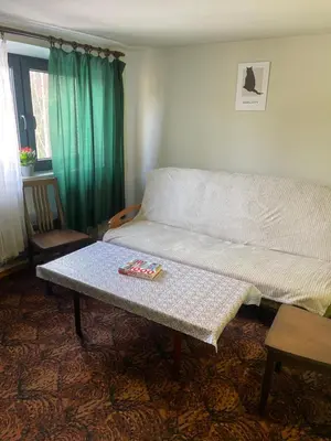 a room with a window with a white curtain at Aparthotel Na Kasztanowej in Kraków