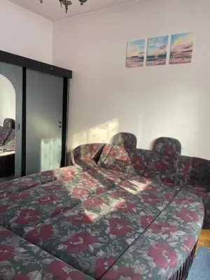 a white cabinet with wine glasses in it at Aparthotel Na Kasztanowej in Kraków