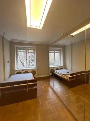a bedroom with two beds and a skylight at Affordable place in city center in Kraków