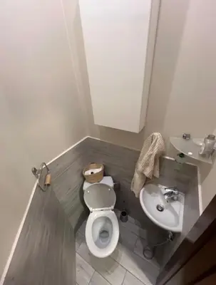 a kitchen with green cabinets and a sink at Affordable place in city center in Kraków