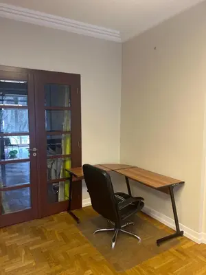 a room with curtains in a room with a wooden floor at Affordable place in city center in Kraków