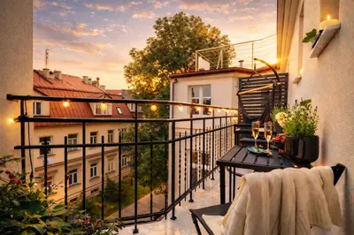 a balcony with a hot tub on top of a building at Old Town Apartment with Private Rooftop Jacuzzi and the Sky Views ! Balcony AC WiFi Parking in Kraków