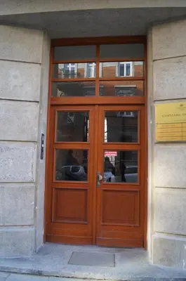 a wooden door on the side of a building at Apartament Ariańska in Kraków