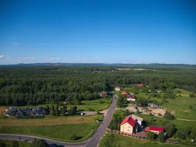 an aerial view of a small town with a road at Zajazd Maj in Bolesław