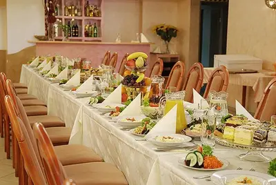 a long table with plates of food on it at Zajazd Maj in Bolesław