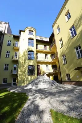 an empty street in front of a building at AR Apartments in Kraków