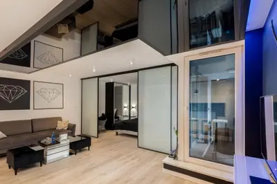 a living room with a couch and a table at Diamonds Apartment in Kraków