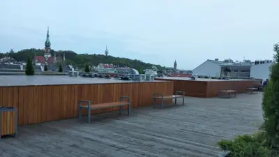 a group of benches sitting on top of a building at Diamonds Apartment in Kraków