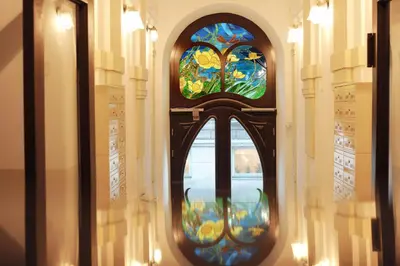 a staircase in a home with a window at Elegant City Center Apartment in Kraków
