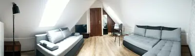 a living room with a couch and a tv at Gospodarstwo Agroturystyczne Watra in Koninki