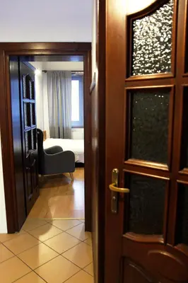 a door leading to a room with a bedroom at Willa Zofia in Rabka