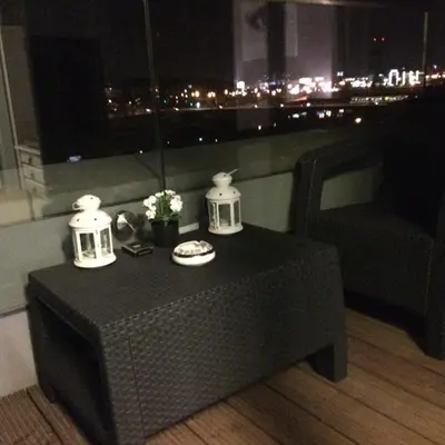 a table in a room with a view of a city at Apartament nad Wisłą in Kraków