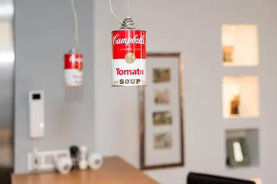 a can of tomato soup hanging from a ceiling at Style4rent Apartament Kazimierz in Kraków