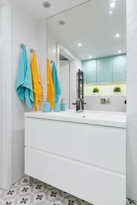 a bathroom with a sink and a mirror at Cheerful Air Conditioned Apartment with mezzanine and Parking - Old Town in Kraków