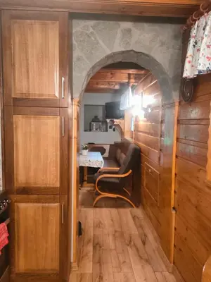 a living room with a couch and a table at Domek Krasnal in Juszczyn