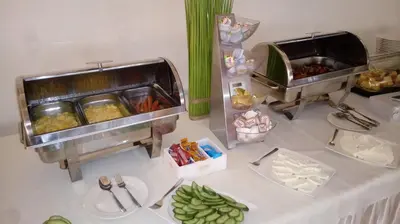 a buffet with food on a table with plates of food at Hotel Graal Targowisko in Targowisko