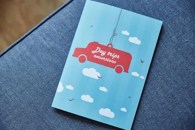 a blue card with clouds and a red truck at PlayRoom II Apartment in Kraków