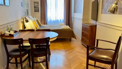 a bedroom with a bed with towels on it at Scharffenberg Apartments Main Square in Kraków