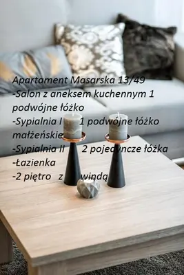 a table with two spoons on top of a coffee table at Apartment Masarska in Kraków
